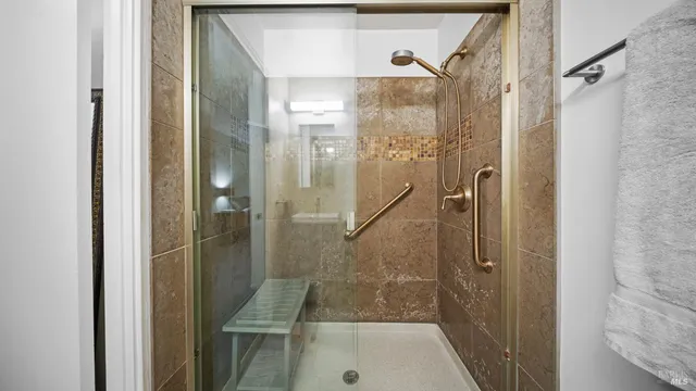 a bathroom with a shower and a sink