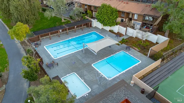 an aerial view of a house with a garden