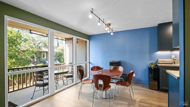 a view of a dining room with furniture window and outside view