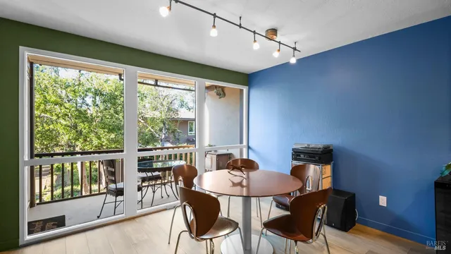 a view of a city from a dining room with furniture window and outside view