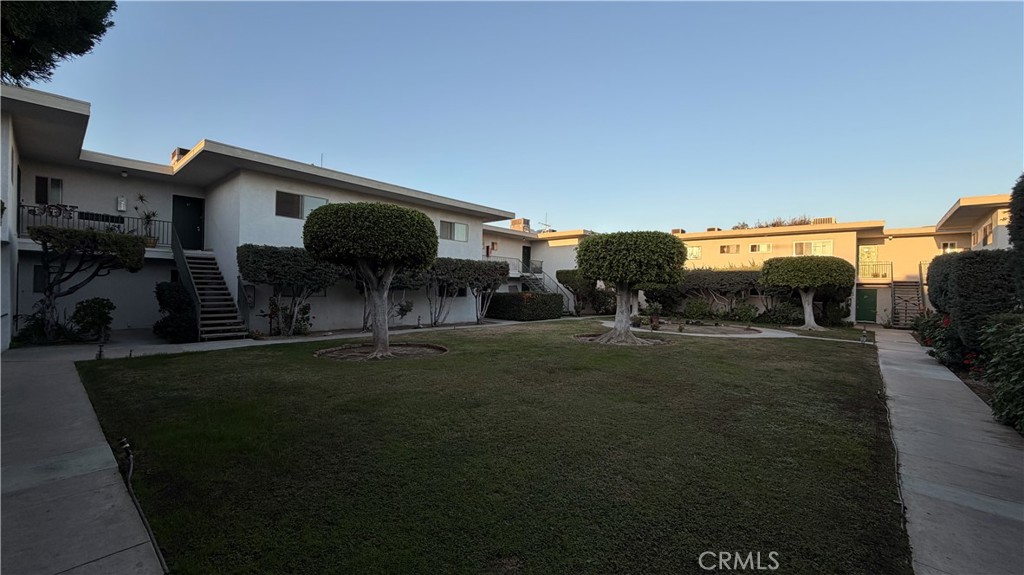 1831 Garvey Avenue, Unit 9 Alhambra, CA 91803 - Photo 12 of 12 a backyard of a house with table and chairs