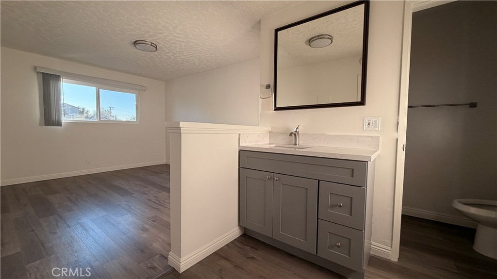 1831 Garvey Avenue, Unit 9 Alhambra, CA 91803 - Photo 5 of 12 a bathroom with a toilet sink and mirror