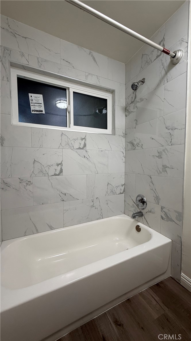 1831 Garvey Avenue, Unit 9 Alhambra, CA 91803 - Photo 9 of 12 a bathroom with a bathtub and a shower