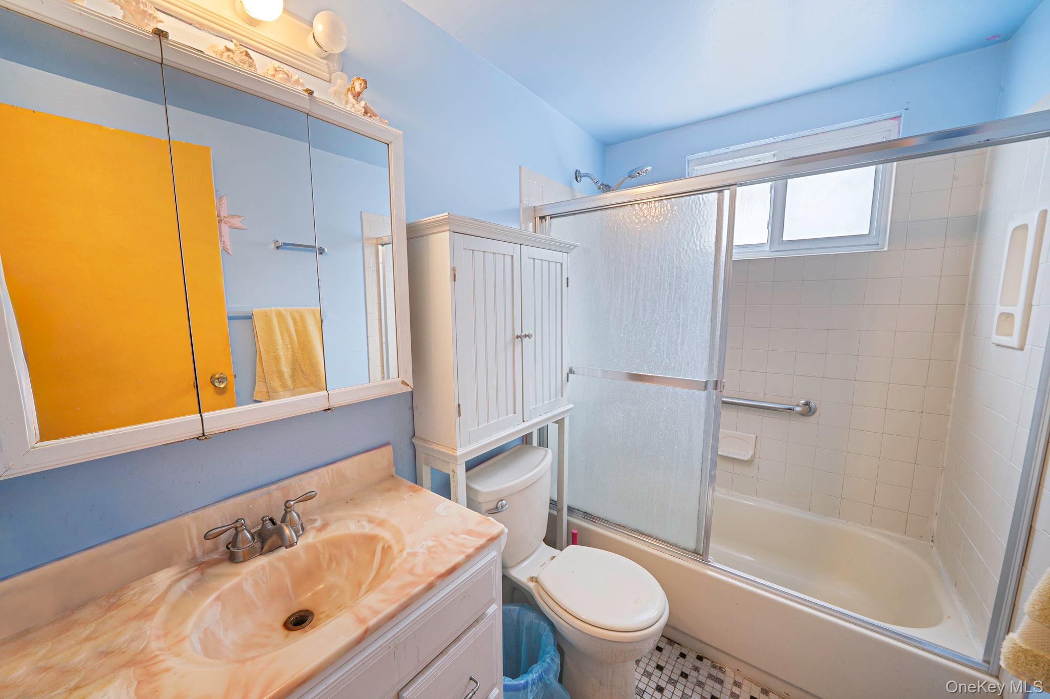 244 Lakeside Trail Ridge, NY 11961 - Photo 18 of 36 Full bath featuring vanity and combined bath / shower with glass door