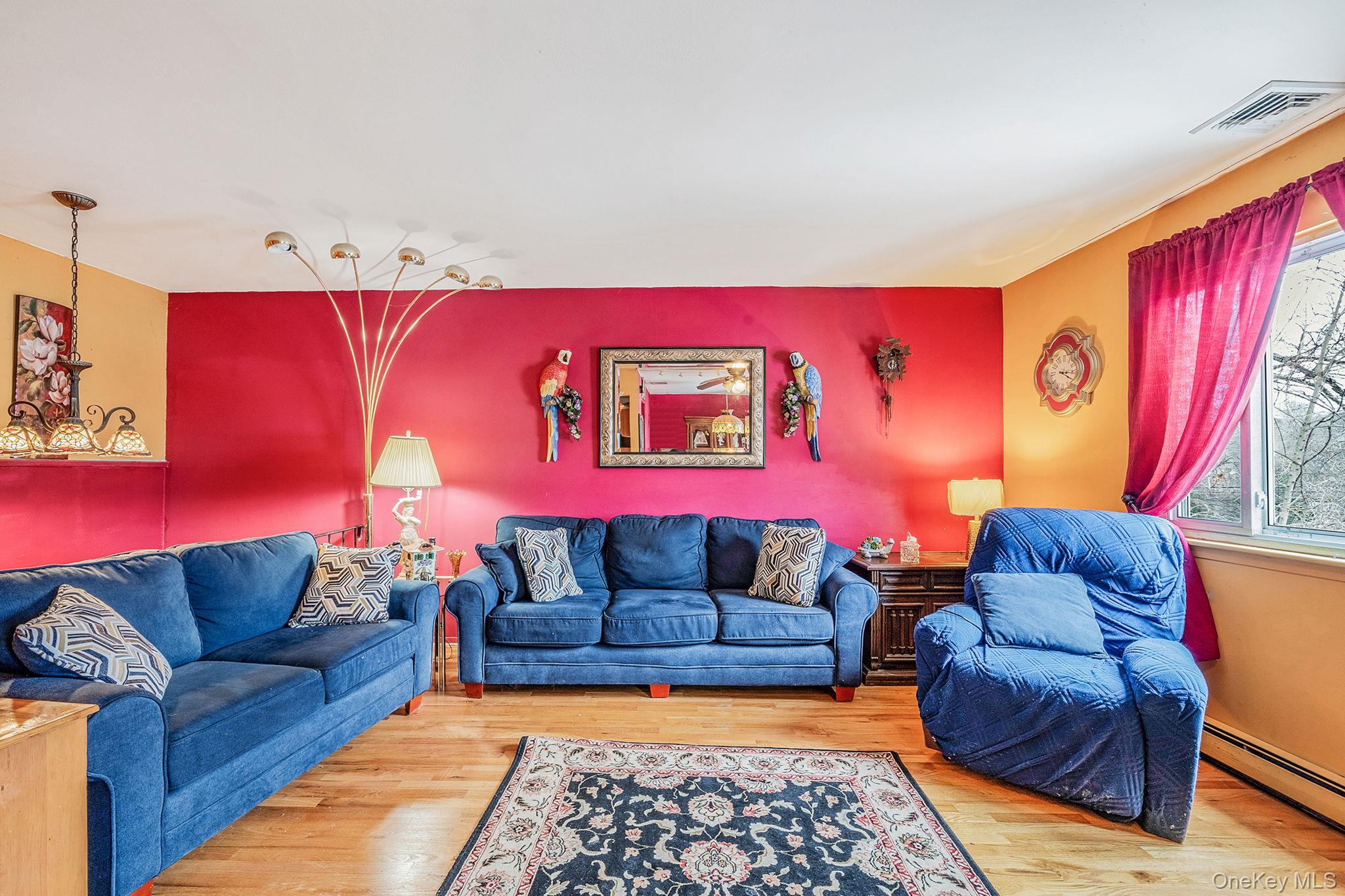 244 Lakeside Trail Ridge, NY 11961 - Photo 22 of 36 Living area with wood finished floors and baseboard heating