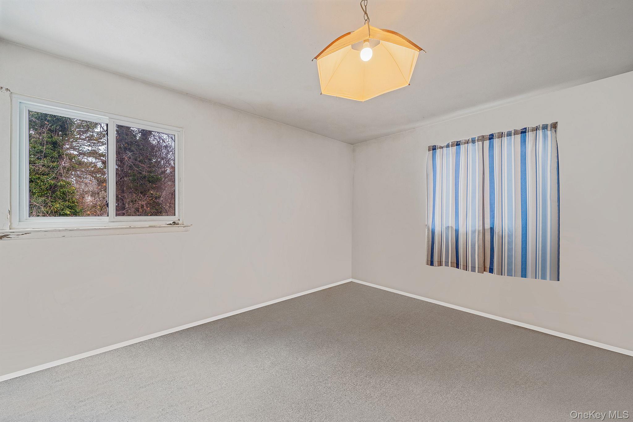 244 Lakeside Trail Ridge, NY 11961 - Photo 33 of 36 Spare room featuring baseboards