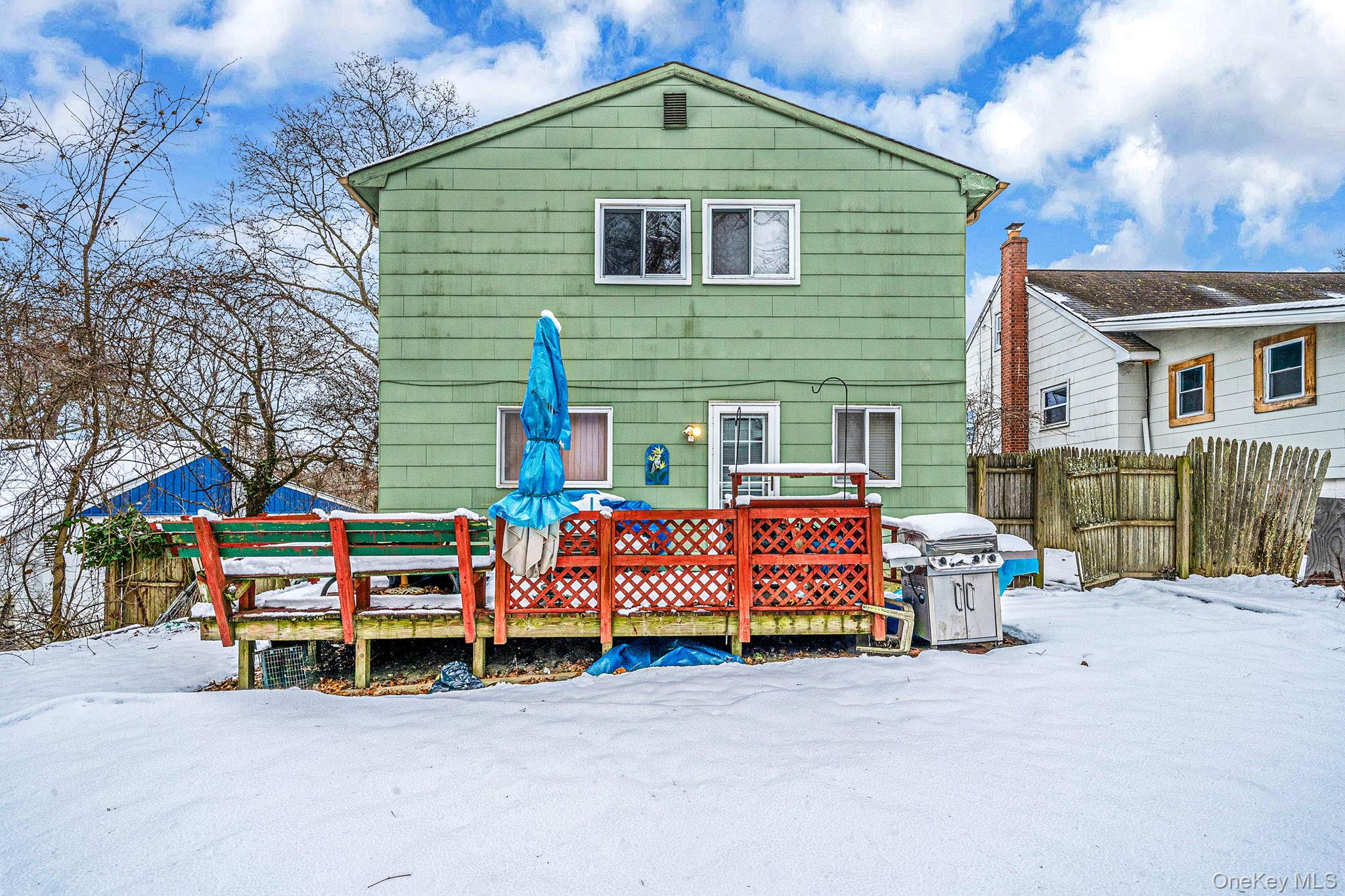 244 Lakeside Trail Ridge, NY 11961 - Photo 10 of 36 Snow covered property with a wooden deck