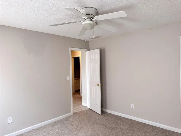 a view of a bathroom from a hallway