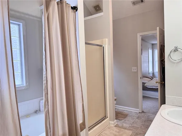 a kitchen with granite countertop a sink a stove and refrigerator