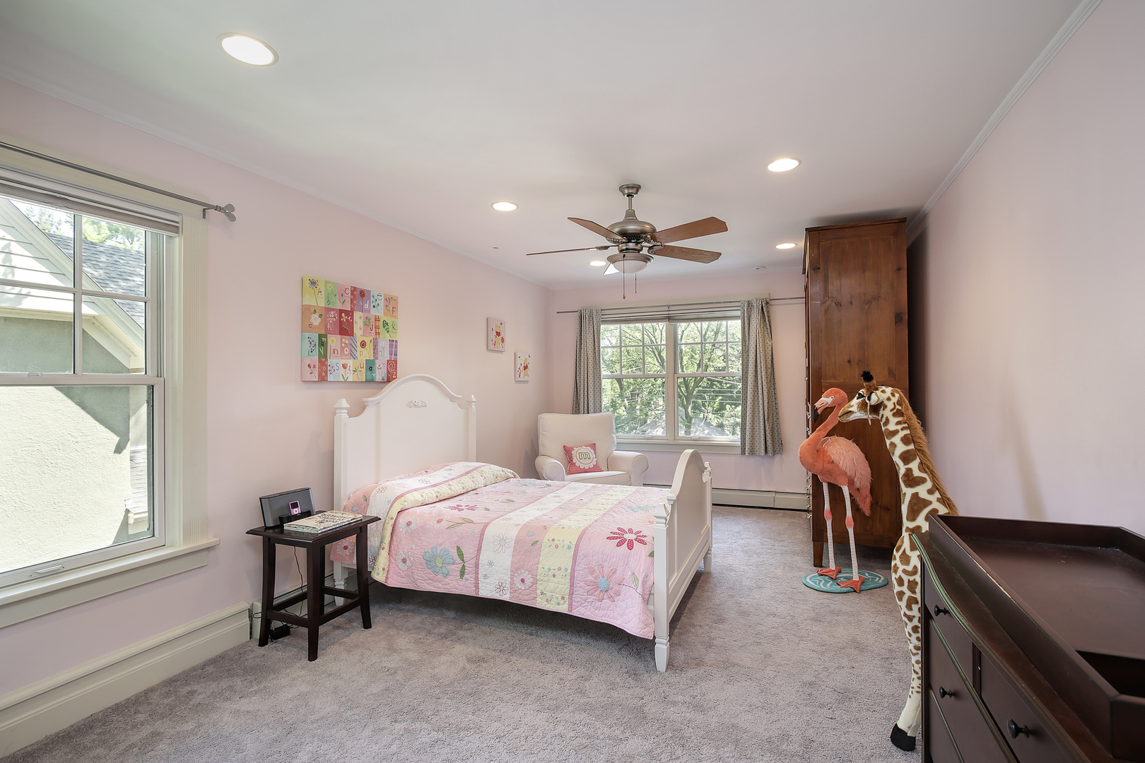 2607 Ridge Avenue Evanston, IL 60201 - Photo 11 of 22 a bedroom with a bed and a chandelier
