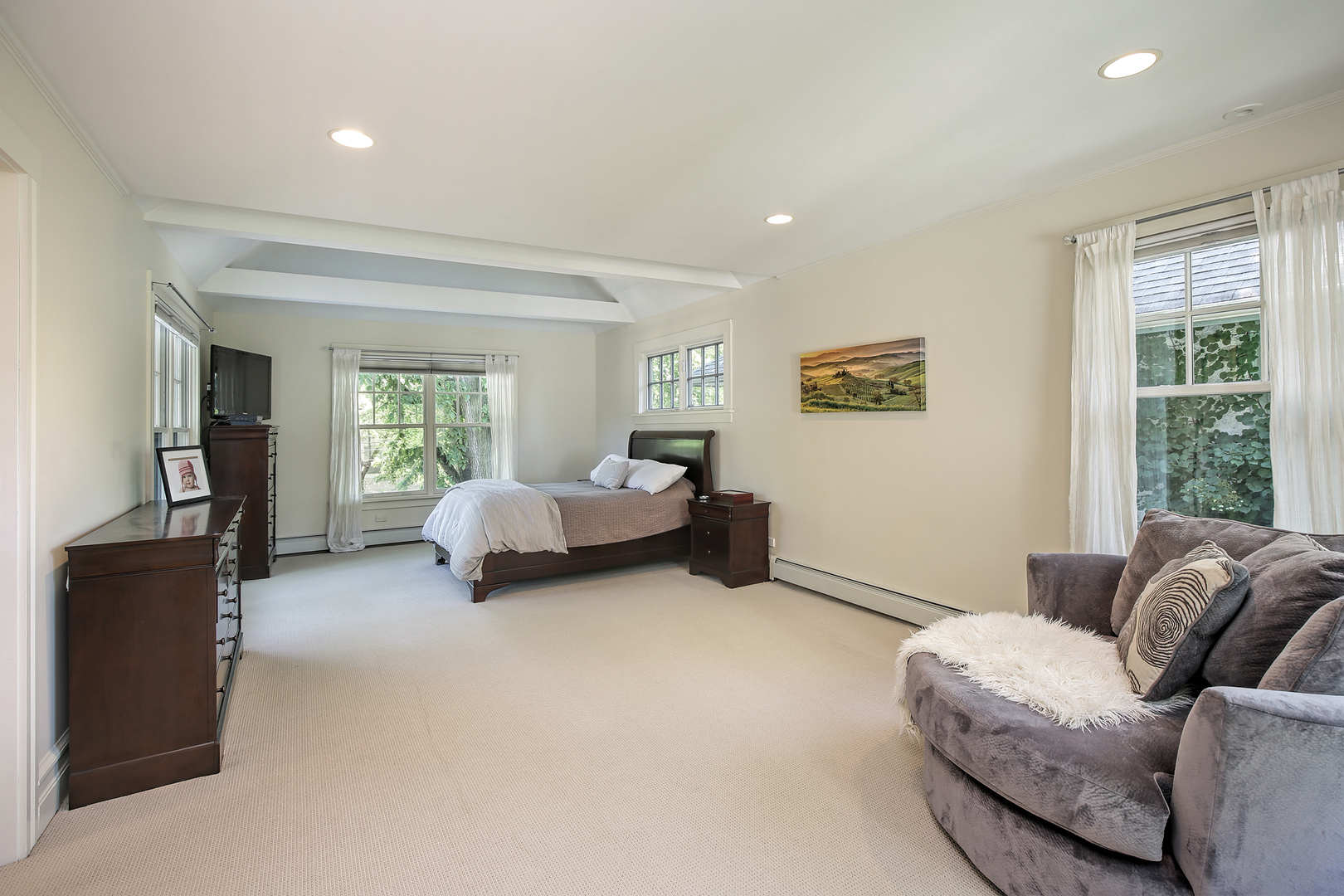 2607 Ridge Avenue Evanston, IL 60201 - Photo 9 of 22 a spacious bedroom with a bed and a couch