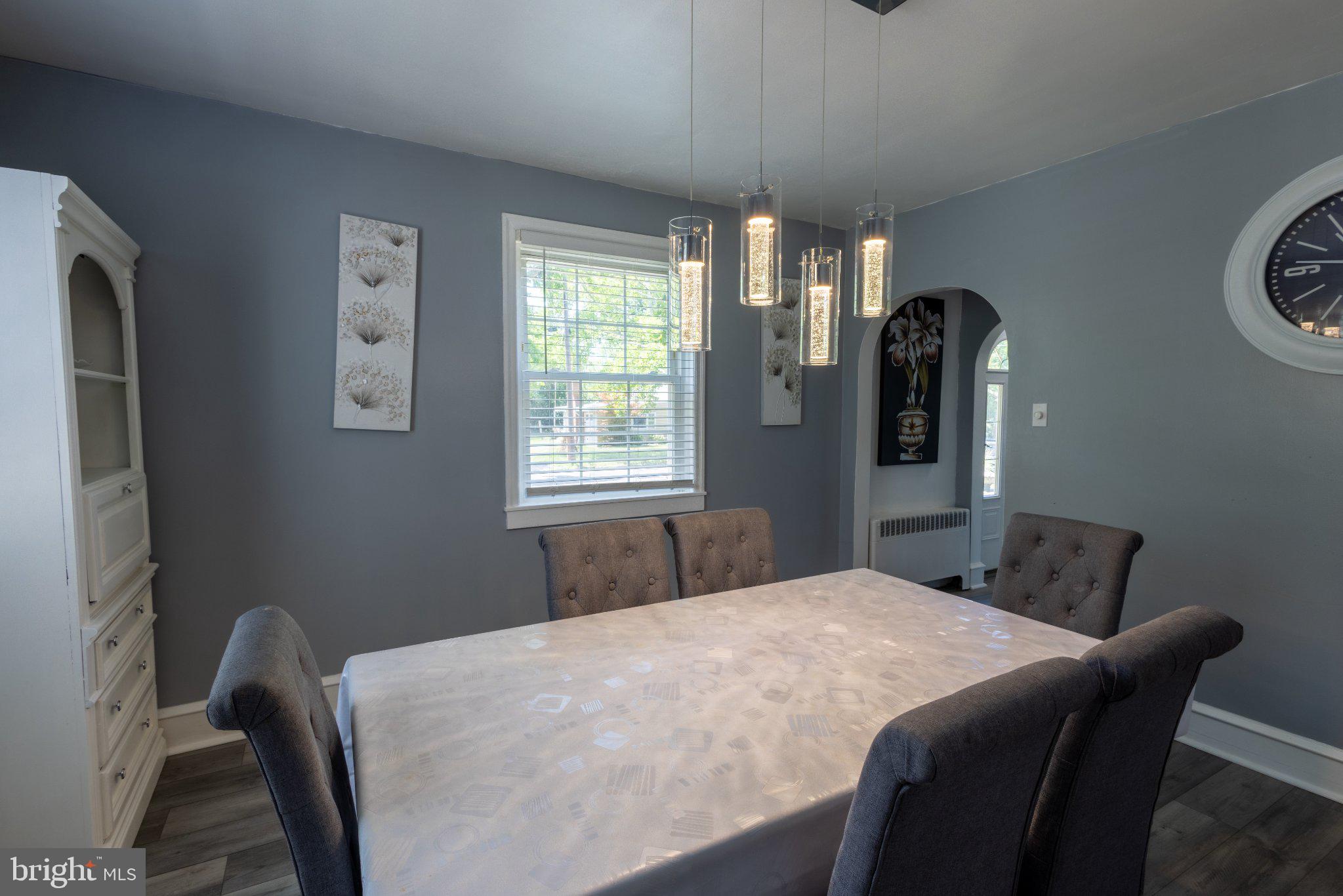 109 Rutgers Avenue Bridgeton, NJ 08302 - Photo 12 of 43 Modern dining space with elegant lighting.
