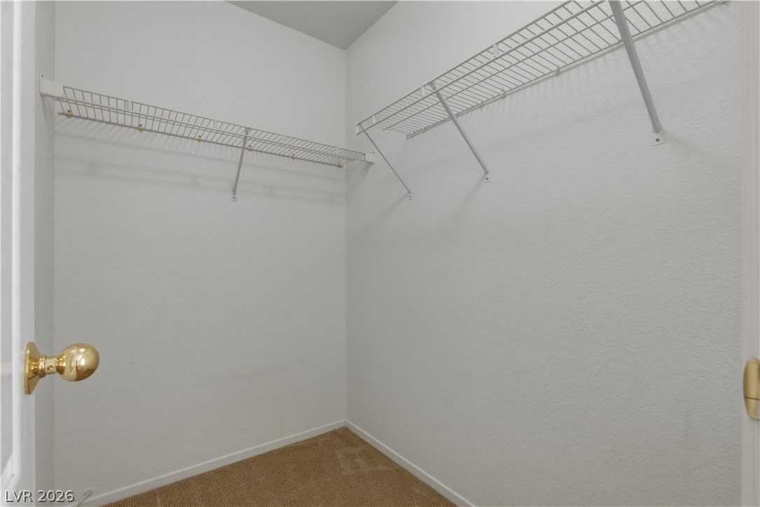 29 Olive Tree Henderson, NV 89074 - Photo 49 of 60 This organized walk-in closet features ample shelving for convenient storage solutions.