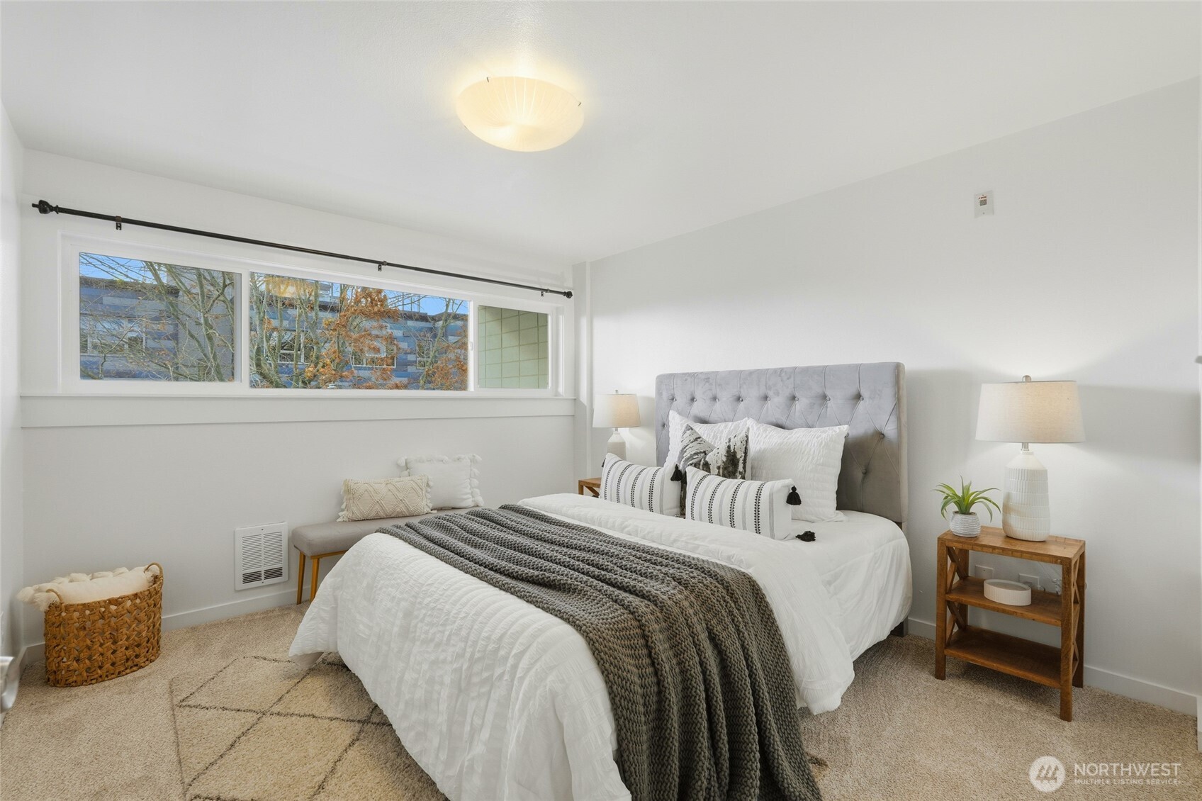 705 East Republican Street, Unit 403 Seattle, WA 98102 - Photo 18 of 28 a bedroom with a bed and a night stand