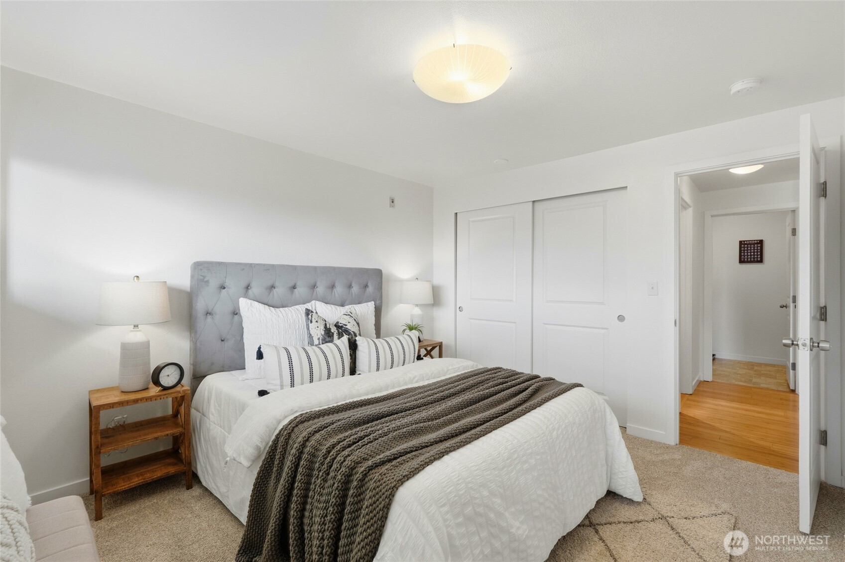 705 East Republican Street, Unit 403 Seattle, WA 98102 - Photo 19 of 28 a bedroom with a bed and a lamp