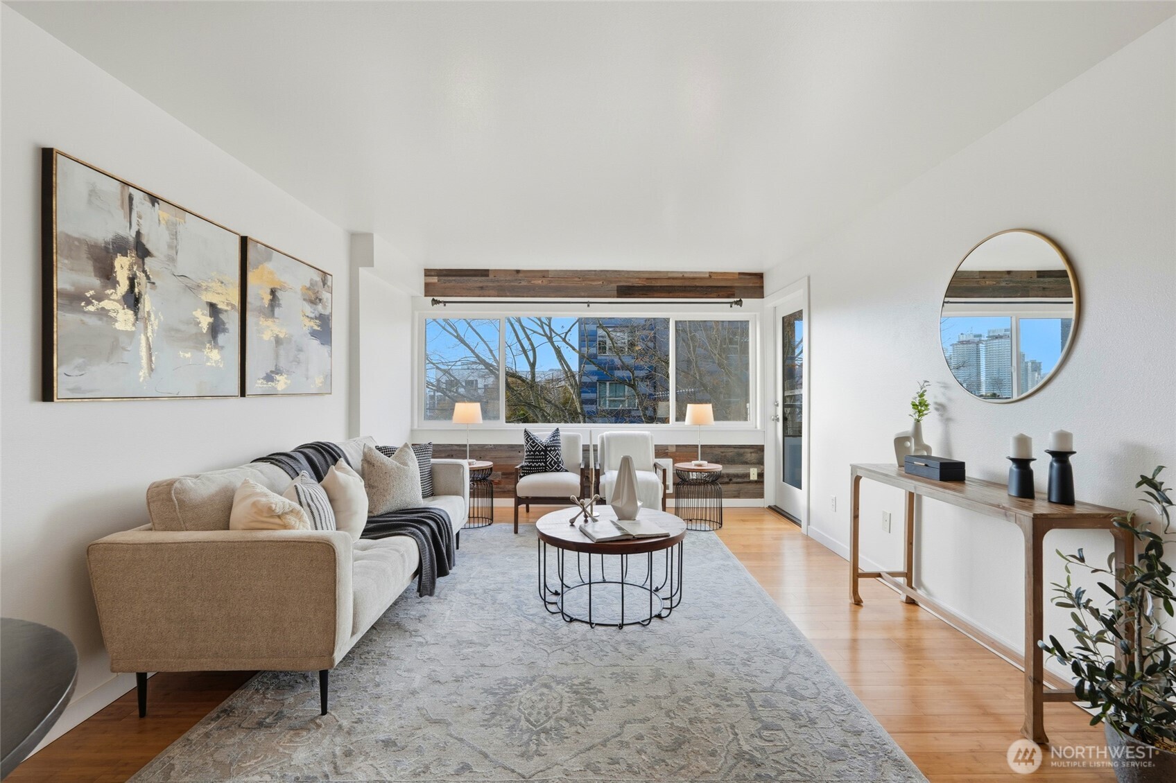 705 East Republican Street, Unit 403 Seattle, WA 98102 - Photo 2 of 28 a living room with furniture and a large window