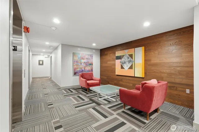 a living room with furniture and a rug