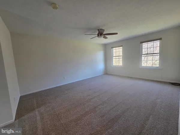 a view of empty room with windows