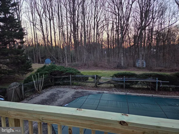 a view of a backyard with sitting area