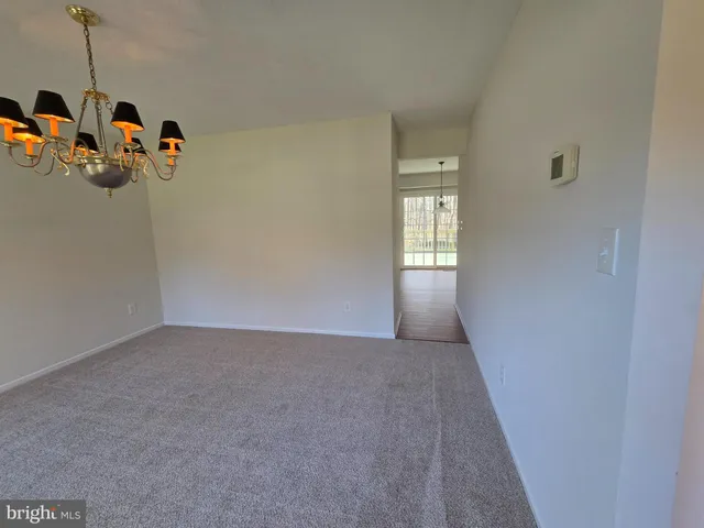 a kitchen with stainless steel appliances granite countertop a stove oven and a refrigerator