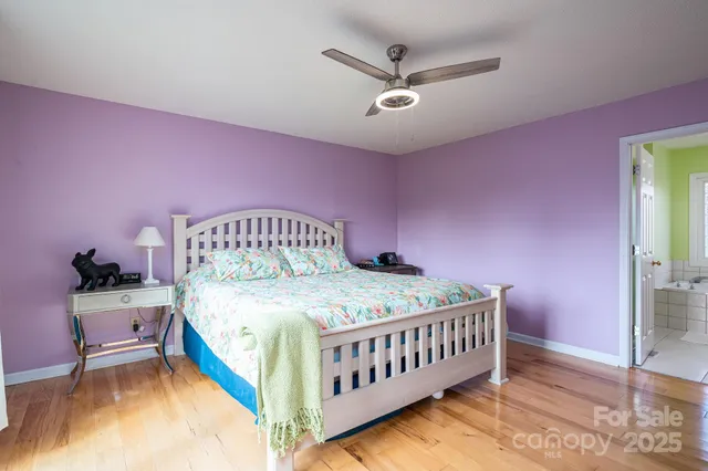 a bedroom with a bed and a table