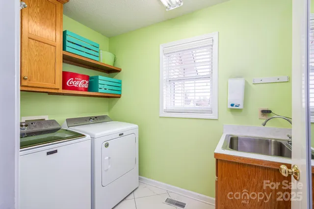 a view of a balcony with chair and iron gate