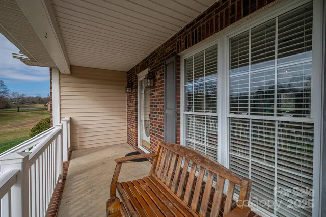 a front view of house with yard and outdoor seating