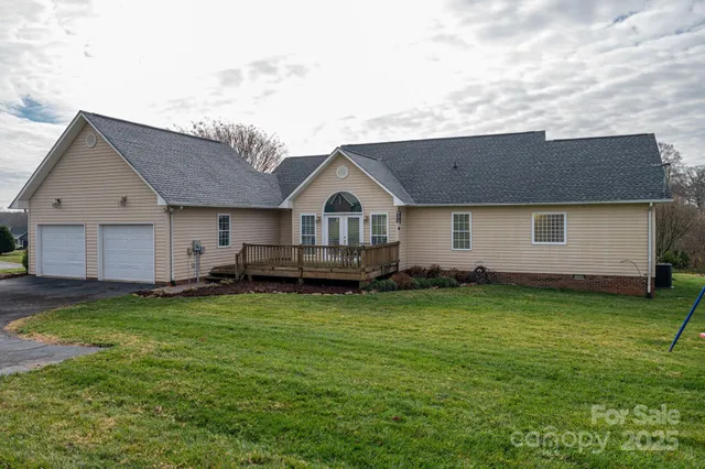 a view of a brick house with many windows