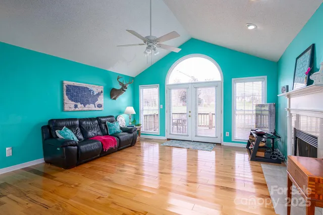 a living room with furniture garden view and a large window