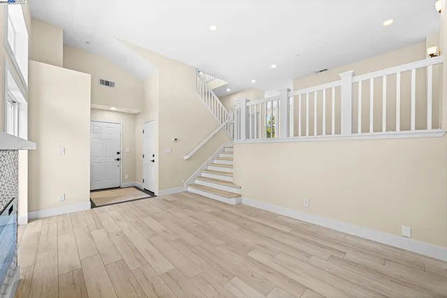 a view of an entryway with wooden floor