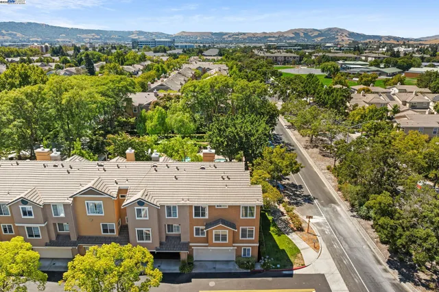 an aerial view of a house with a garden
