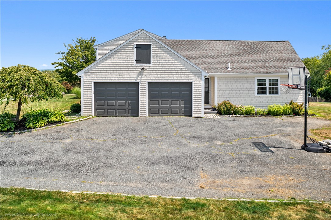 85 Lepes Road Portsmouth, RI 02871 - Photo 4 of 50 The entry door from the garage into the house has been replaced with a steel door.
The exterior door to the right of the garage is the entry to the private wing of the home.