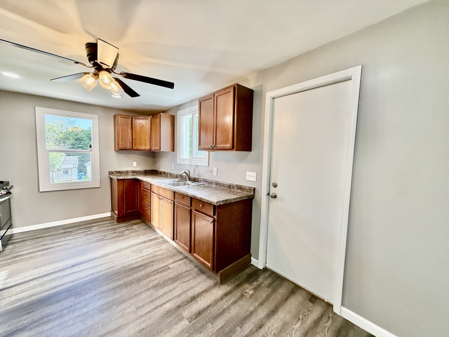 2703 Main Street Peru, IL 61354 - Photo 11 of 23 a kitchen with stainless steel appliances granite countertop a stove a sink and a refrigerator