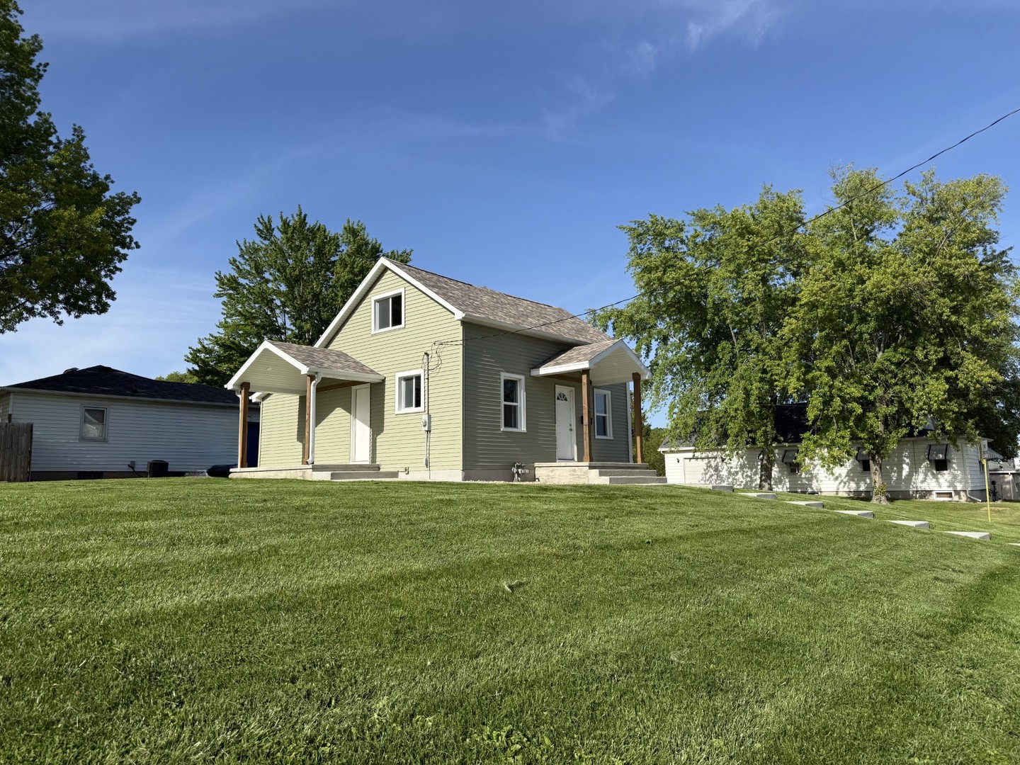 2703 Main Street Peru, IL 61354 - Photo 4 of 23 a front view of a house with a yard