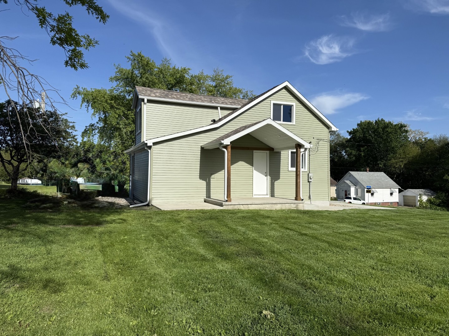 2703 Main Street Peru, IL 61354 - Photo 5 of 23 a front view of a house with a yard and garage