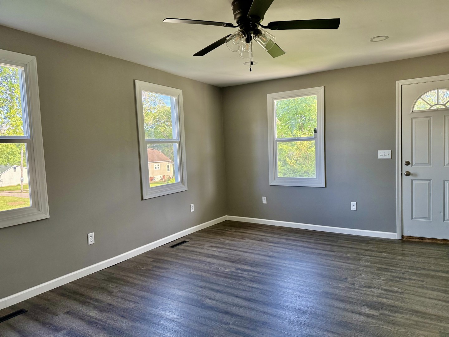 2703 Main Street Peru, IL 61354 - Photo 7 of 23 a view of an empty room with wooden floor and a window