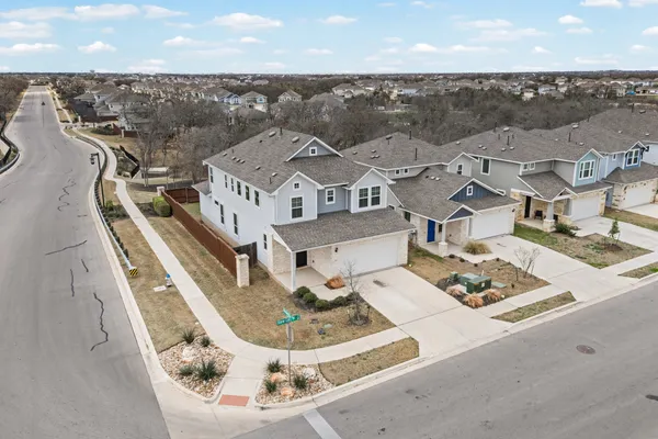 an aerial view of a house with a garden