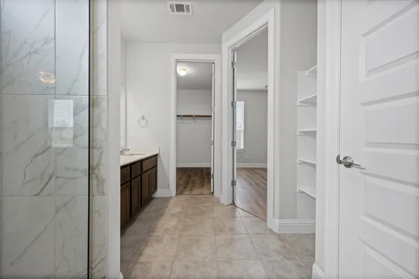 a view of a hallway with closet area