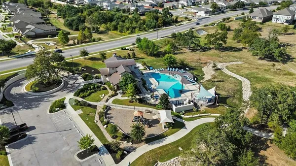 an aerial view of a house with yard swimming pool and outdoor seating