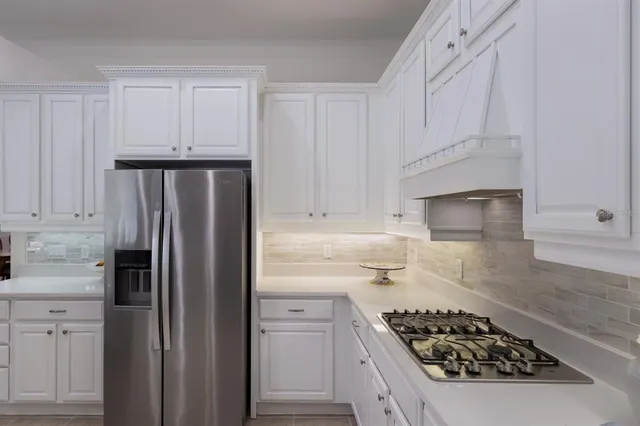 a view of a dining room with furniture wooden floor and chandelier