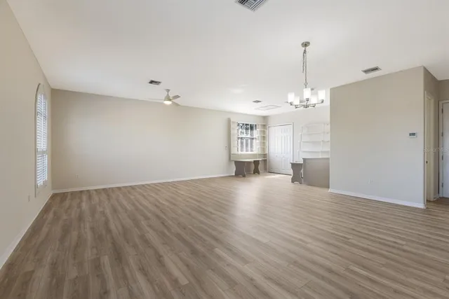 a view of a garden with a building in the background