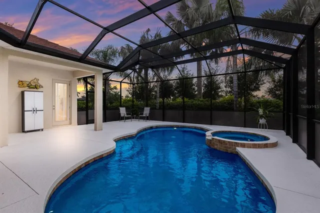 a view of a house with a yard and potted plants
