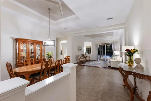 a living room with furniture and floor to ceiling window