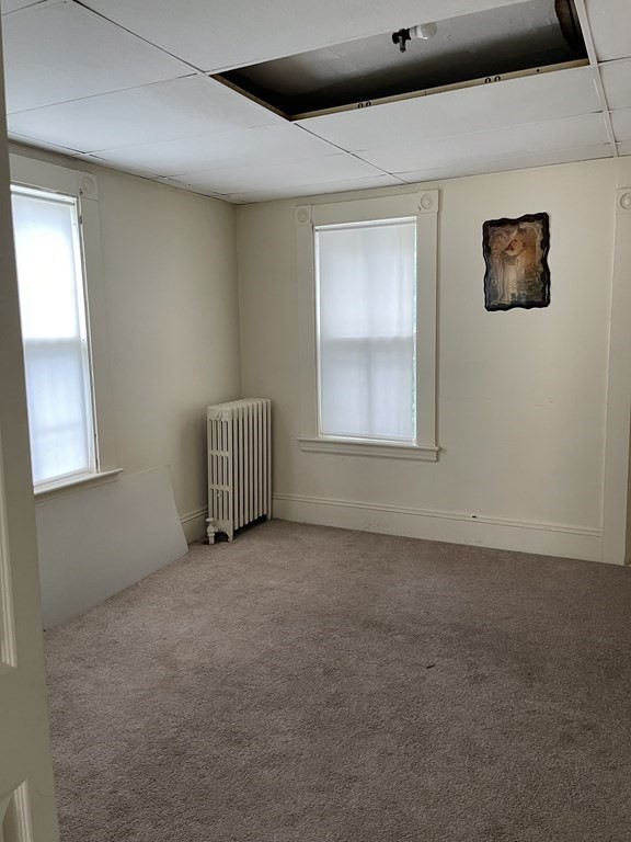 352 Broadway Lynn, MA 01904 - Photo 2 of 6 an empty room with windows
