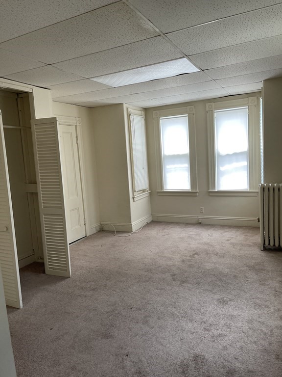 352 Broadway Lynn, MA 01904 - Photo 4 of 6 an empty room with windows