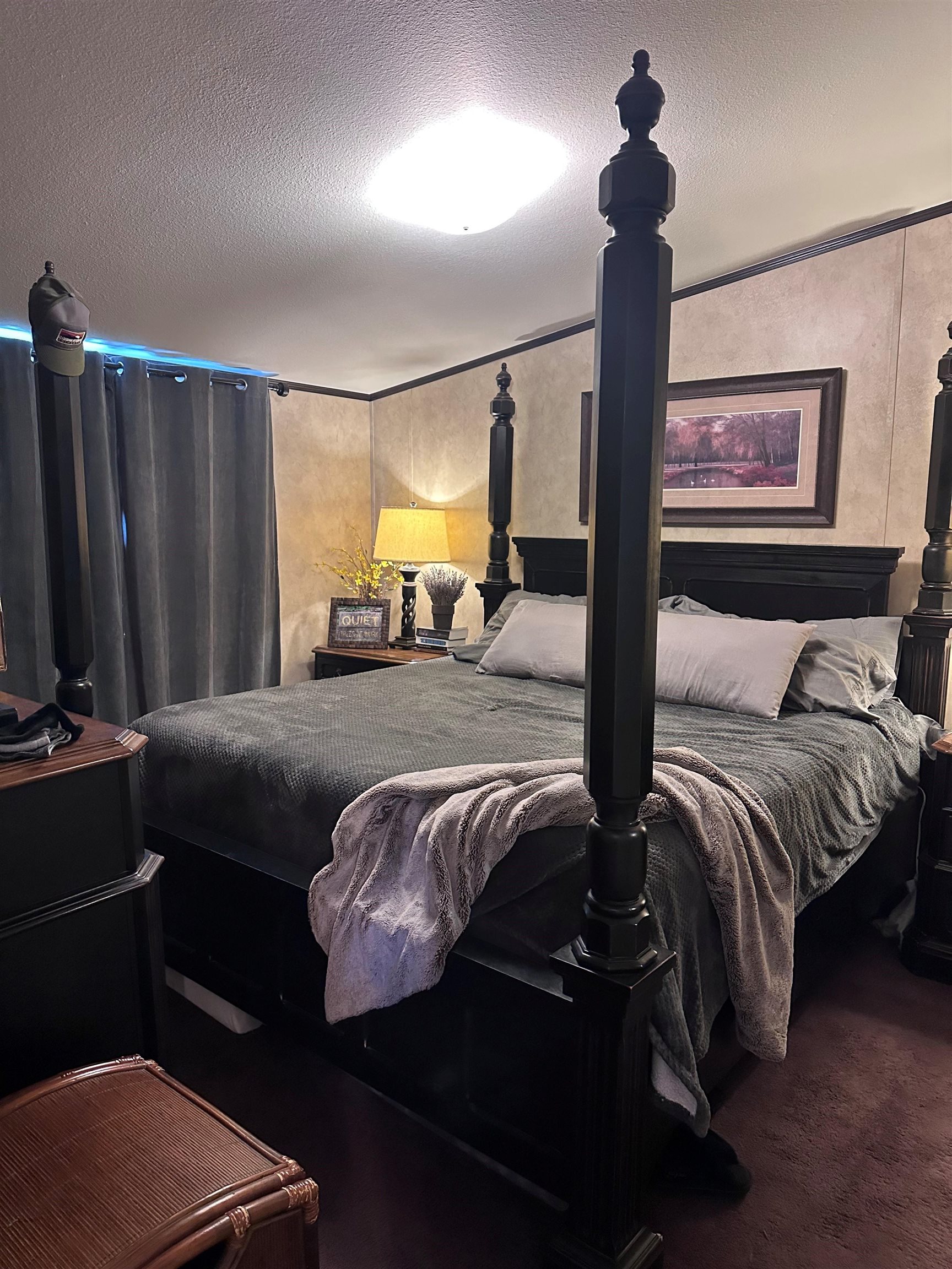 585-25 25 1/2 Road, Unit 125 Grand Junction, CO 81505 - Photo 15 of 24 a bedroom with a bed a mirror and a window