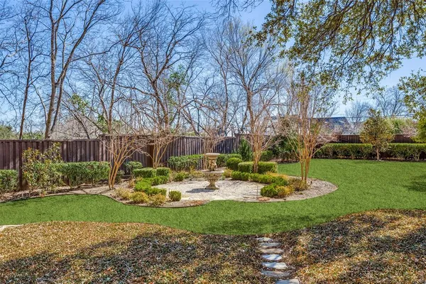 a view of a backyard with tree s