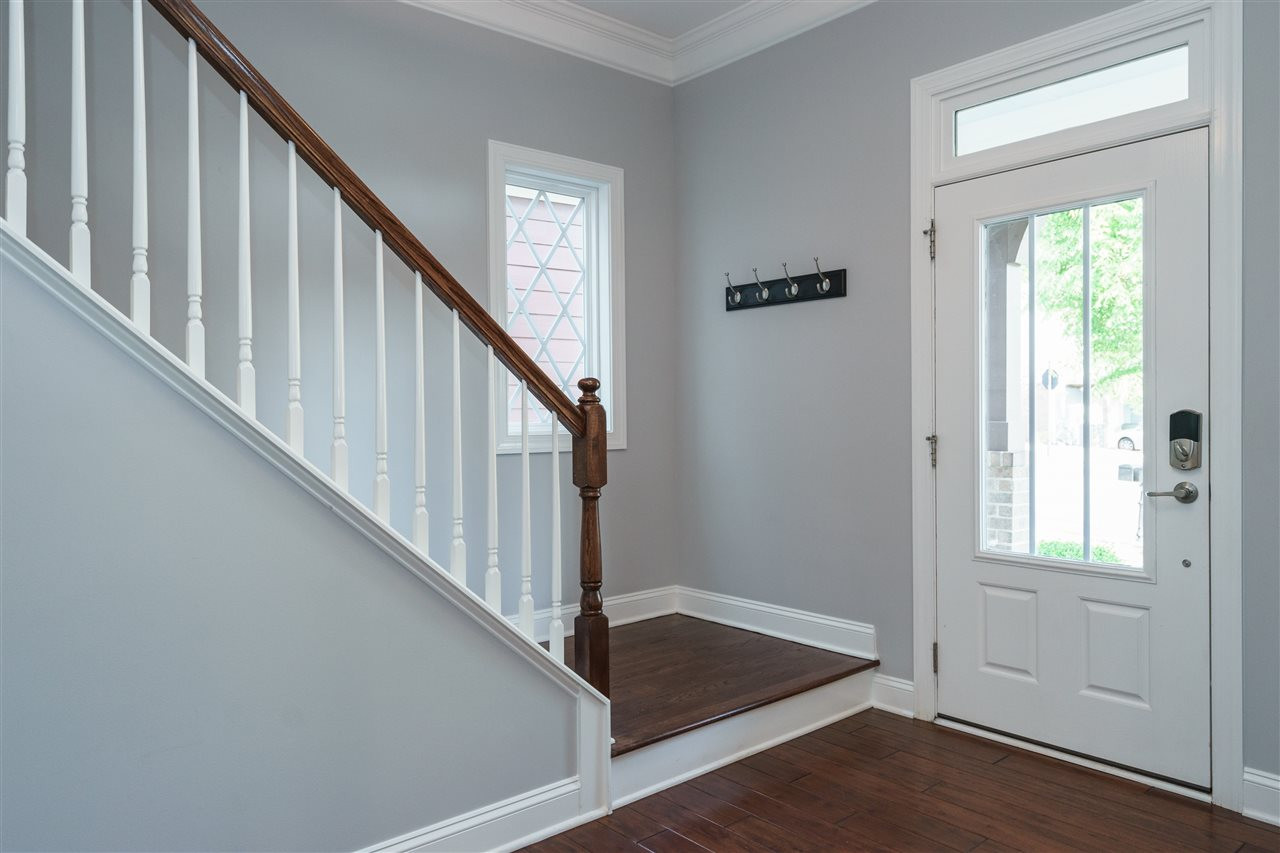 FOYER WITH BEAUTIFUL NATURAL LIGHTING AND HARDWOODS STAIRS! FOYER