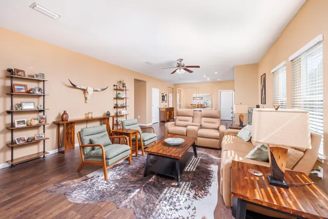 a living room with lots of furniture and white walls