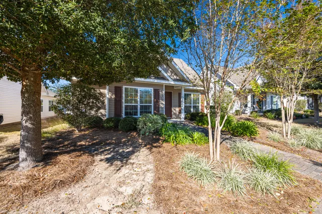 a view of a patio with a table and chairs
